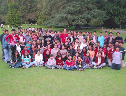 A Group of students with their teachers on a school tour
		 conducted by Sunil Tours